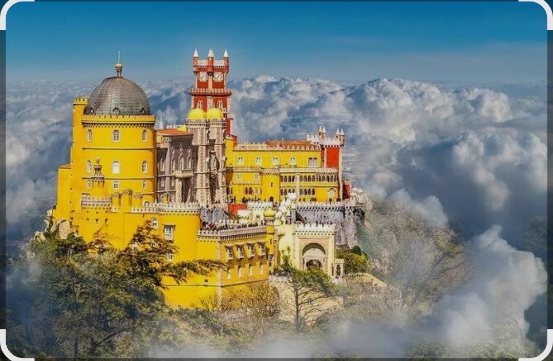 Pena Palace above the misty hills of Sintra