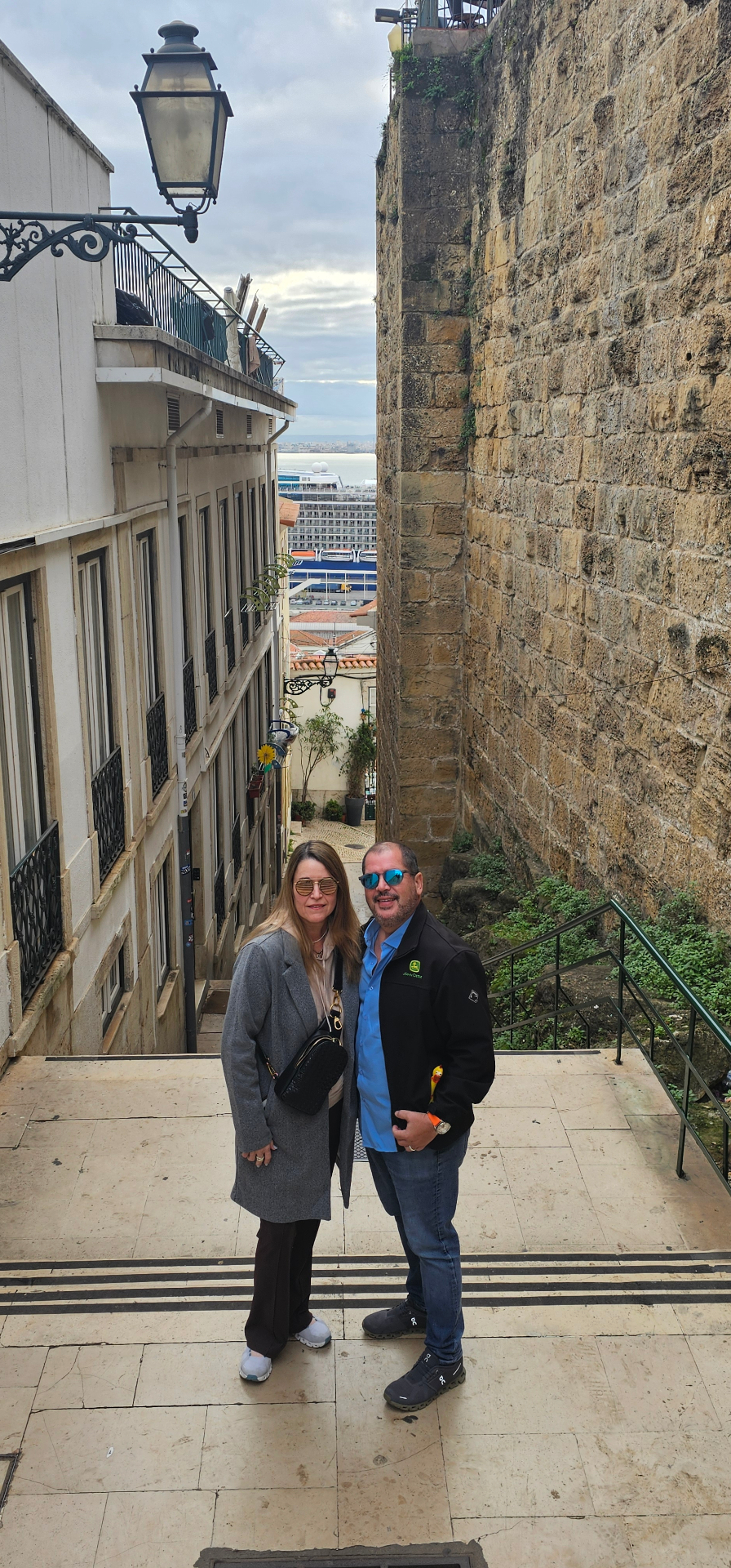 Couple on the old stone stairways of Alfama