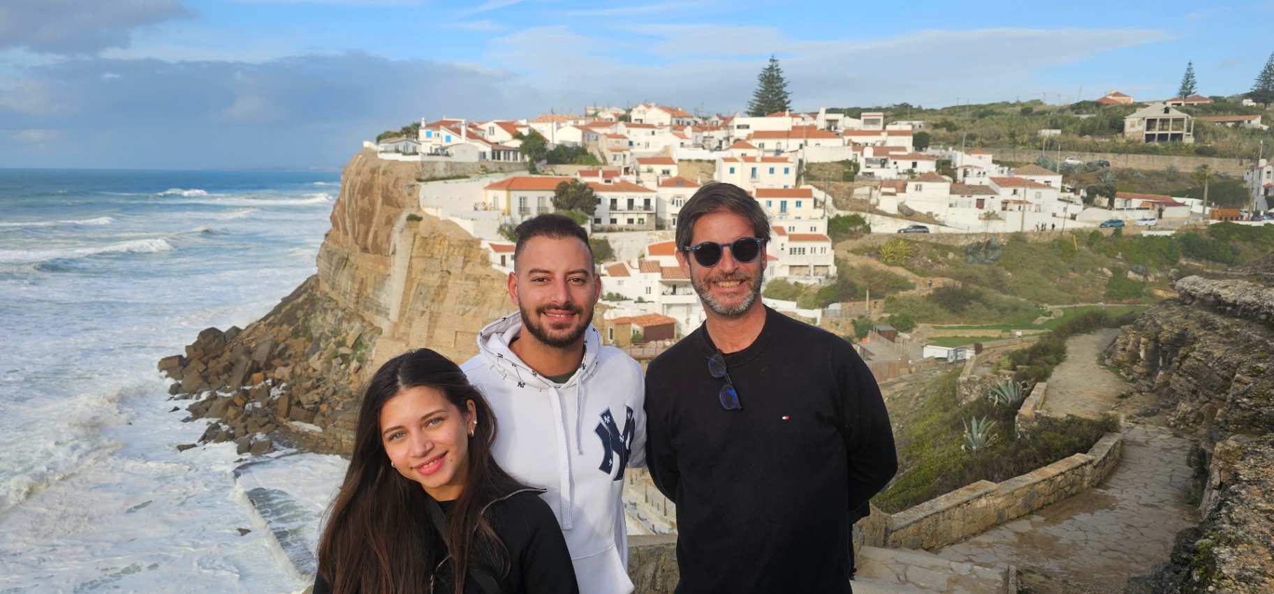 Family above the waves at Azenhas do Mar
