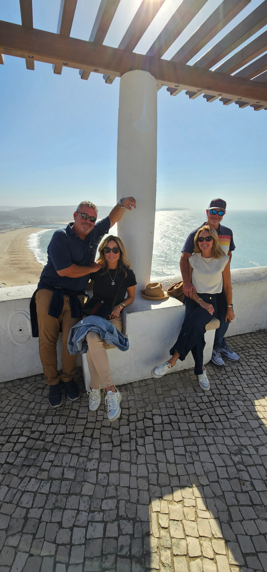Guests under the pergola at the Nazaré clifftop lookout