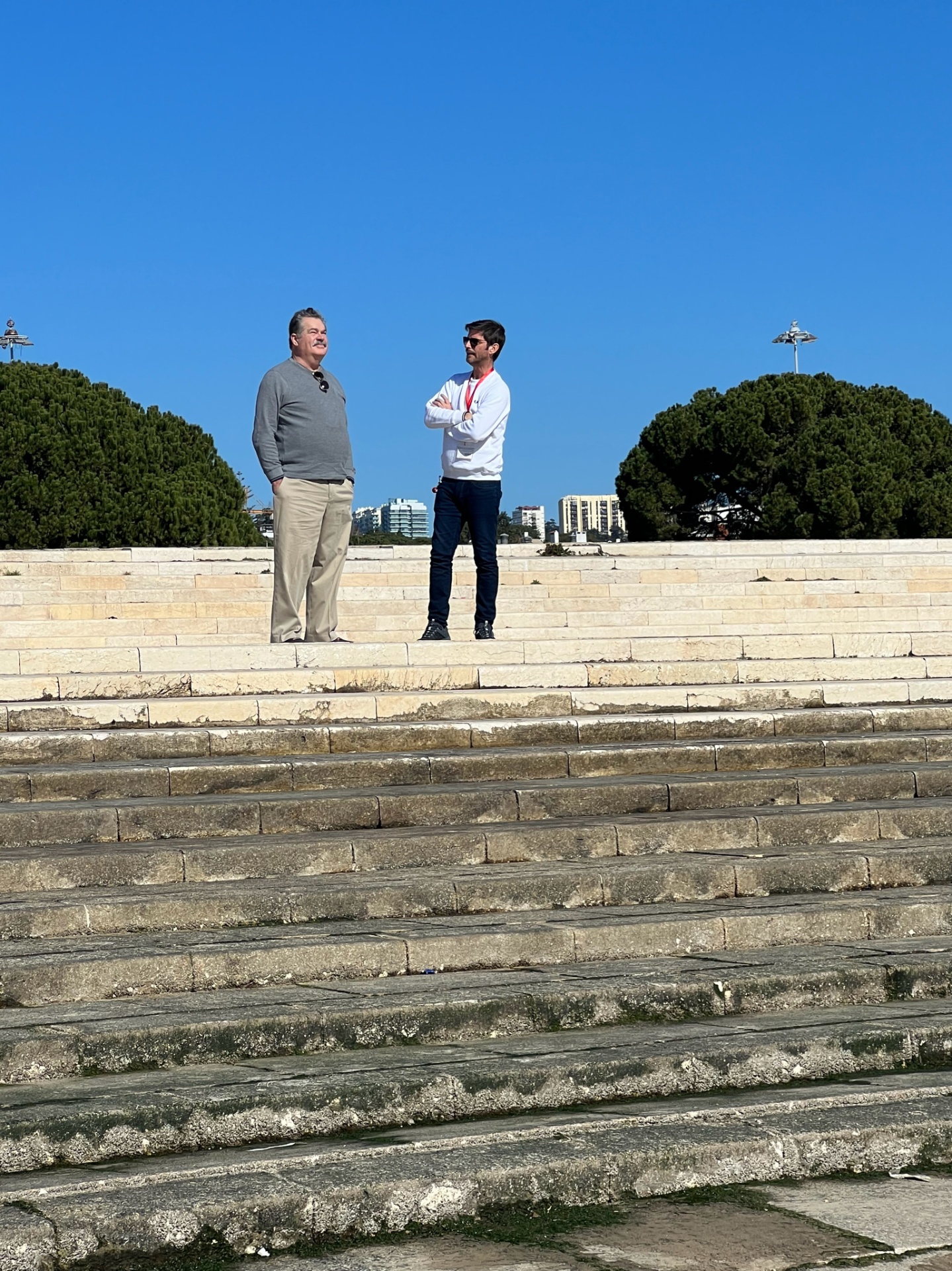 Guests on the steps of the Belém waterfront
